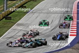 (L to R): Yuki Tsunoda (JPN) RB VCARB 01 and Fernando Alonso (ESP) Aston Martin F1 Team AMR24 at the start of Sprint. 29.06.2024. Formula 1 World Championship, Rd 11, Austrian Grand Prix, Spielberg, Austria, Sprint and Qualifying Day.