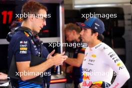 (L to R): Hugh Bird (GBR) Red Bull Racing Engineer with Sergio Perez (MEX) Red Bull Racing. 29.06.2024. Formula 1 World Championship, Rd 11, Austrian Grand Prix, Spielberg, Austria, Sprint and Qualifying Day.
