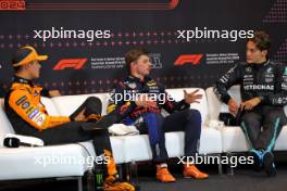 (L to R): Lando Norris (GBR) McLaren; Max Verstappen (NLD) Red Bull Racing; and George Russell (GBR) Mercedes AMG F1, in the post qualifying FIA Press Conference. 29.06.2024. Formula 1 World Championship, Rd 11, Austrian Grand Prix, Spielberg, Austria, Sprint and Qualifying Day.