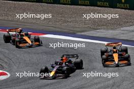 Max Verstappen (NLD) Red Bull Racing RB20 leads Lando Norris (GBR) McLaren MCL38 and Oscar Piastri (AUS) McLaren MCL38. 29.06.2024. Formula 1 World Championship, Rd 11, Austrian Grand Prix, Spielberg, Austria, Sprint and Qualifying Day.