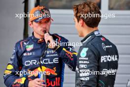 (L to R): Pole sitter Max Verstappen (NLD) Red Bull Racing in qualifying parc ferme with third placed George Russell (GBR) Mercedes AMG F1. 29.06.2024. Formula 1 World Championship, Rd 11, Austrian Grand Prix, Spielberg, Austria, Sprint and Qualifying Day.