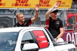 (L to R): Kevin Magnussen (DEN) Haas F1 Team and Nico Hulkenberg (GER) Haas F1 Team on the drivers' parade. 30.06.2024. Formula 1 World Championship, Rd 11, Austrian Grand Prix, Spielberg, Austria, Race Day.