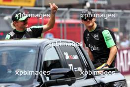 (L to R): Valtteri Bottas (FIN) Sauber and Zhou Guanyu (CHN) Sauber on the drivers' parade. 30.06.2024. Formula 1 World Championship, Rd 11, Austrian Grand Prix, Spielberg, Austria, Race Day.