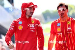 (L to R): Charles Leclerc (MON) Ferrari with team mate Carlos Sainz Jr (ESP) Ferrari. 27.06.2024. Formula 1 World Championship, Rd 11, Austrian Grand Prix, Spielberg, Austria, Preparation Day.