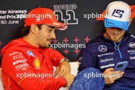 (L to R): Charles Leclerc (MON) Ferrari and Logan Sargeant (USA) Williams Racing in the FIA Press Conference. 27.06.2024. Formula 1 World Championship, Rd 11, Austrian Grand Prix, Spielberg, Austria, Preparation Day.