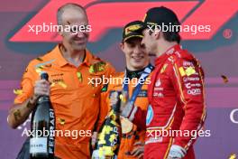 Race winner Oscar Piastri (AUS) McLaren celebrates on the podium with Tom Stallard (GBR) McLaren Race Engineer and third placed Charles Leclerc (MON) Ferrari. 15.09.2024. Formula 1 World Championship, Rd 17, Azerbaijan Grand Prix, Baku Street Circuit, Azerbaijan, Race Day.