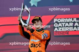 Race winner Oscar Piastri (AUS) McLaren celebrates on the podium. 15.09.2024. Formula 1 World Championship, Rd 17, Azerbaijan Grand Prix, Baku Street Circuit, Azerbaijan, Race Day.