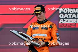 Race winner Oscar Piastri (AUS) McLaren celebrates on the podium. 15.09.2024. Formula 1 World Championship, Rd 17, Azerbaijan Grand Prix, Baku Street Circuit, Azerbaijan, Race Day.