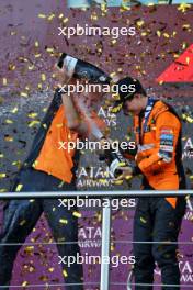 Race winner Oscar Piastri (AUS) McLaren celebrates on the podium with Tom Stallard (GBR) McLaren Race Engineer. 15.09.2024. Formula 1 World Championship, Rd 17, Azerbaijan Grand Prix, Baku Street Circuit, Azerbaijan, Race Day.