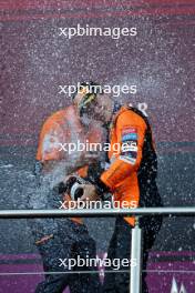 Race winner Oscar Piastri (AUS) McLaren celebrates on the podium with Tom Stallard (GBR) McLaren Race Engineer. 15.09.2024. Formula 1 World Championship, Rd 17, Azerbaijan Grand Prix, Baku Street Circuit, Azerbaijan, Race Day.