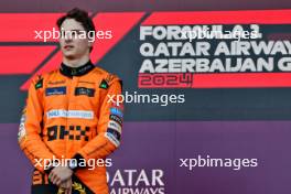 Race winner Oscar Piastri (AUS) McLaren celebrates on the podium. 15.09.2024. Formula 1 World Championship, Rd 17, Azerbaijan Grand Prix, Baku Street Circuit, Azerbaijan, Race Day.