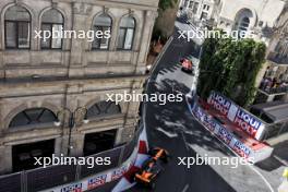 Charles Leclerc (MON) Ferrari SF-24 leads Oscar Piastri (AUS) McLaren MCL38. 15.09.2024. Formula 1 World Championship, Rd 17, Azerbaijan Grand Prix, Baku Street Circuit, Azerbaijan, Race Day.