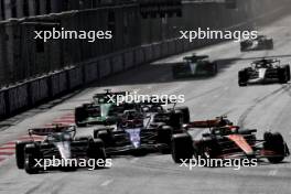 Nico Hulkenberg (GER) Haas VF-24 and Lando Norris (GBR) McLaren MCL38. 15.09.2024. Formula 1 World Championship, Rd 17, Azerbaijan Grand Prix, Baku Street Circuit, Azerbaijan, Race Day.