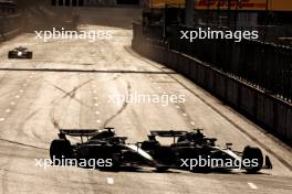 Oliver Bearman (GBR) Haas VF-24 and Lewis Hamilton (GBR) Mercedes AMG F1 W15 battle for position. 15.09.2024. Formula 1 World Championship, Rd 17, Azerbaijan Grand Prix, Baku Street Circuit, Azerbaijan, Race Day.