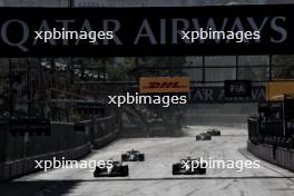 (L to R): Nico Hulkenberg (GER) Haas VF-24 and team mate Oliver Bearman (GBR) Haas VF-24 battle for position. 15.09.2024. Formula 1 World Championship, Rd 17, Azerbaijan Grand Prix, Baku Street Circuit, Azerbaijan, Race Day.