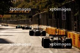 Alexander Albon (THA) Williams Racing FW46 leads Oliver Bearman (GBR) Haas VF-24. 15.09.2024. Formula 1 World Championship, Rd 17, Azerbaijan Grand Prix, Baku Street Circuit, Azerbaijan, Race Day.