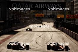 Charles Leclerc (MON) Ferrari SF-24 and Oscar Piastri (AUS) McLaren MCL38 battle for position. 15.09.2024. Formula 1 World Championship, Rd 17, Azerbaijan Grand Prix, Baku Street Circuit, Azerbaijan, Race Day.