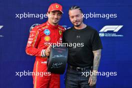 (L to R): Charles Leclerc (MON) Ferrari is presented with the Pirelli Pole Position Award by J Balvin (COL) Singer. 14.09.2024. Formula 1 World Championship, Rd 17, Azerbaijan Grand Prix, Baku Street Circuit, Azerbaijan, Qualifying Day.