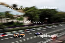 Yuki Tsunoda (JPN) RB VCARB 01 leads Oscar Piastri (AUS) McLaren MCL38. 14.09.2024. Formula 1 World Championship, Rd 17, Azerbaijan Grand Prix, Baku Street Circuit, Azerbaijan, Qualifying Day.