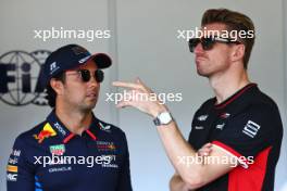 (L to R): Sergio Perez (MEX) Red Bull Racing and Nico Hulkenberg (GER) Haas F1 Team on the drivers' parade. 15.09.2024. Formula 1 World Championship, Rd 17, Azerbaijan Grand Prix, Baku Street Circuit, Azerbaijan, Race Day.