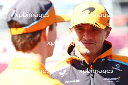 Lando Norris (GBR) McLaren and team mate Oscar Piastri (AUS) McLaren on the drivers' parade. 15.09.2024. Formula 1 World Championship, Rd 17, Azerbaijan Grand Prix, Baku Street Circuit, Azerbaijan, Race Day.