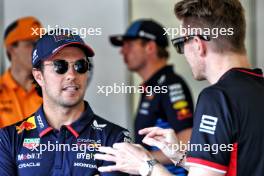 (L to R): Sergio Perez (MEX) Red Bull Racing and Nico Hulkenberg (GER) Haas F1 Team on the drivers' parade. 15.09.2024. Formula 1 World Championship, Rd 17, Azerbaijan Grand Prix, Baku Street Circuit, Azerbaijan, Race Day.