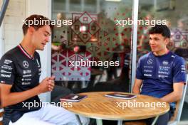 (L to R): George Russell (GBR) Mercedes AMG F1 with Alexander Albon (THA) Williams Racing. 12.09.2024. Formula 1 World Championship, Rd 17, Azerbaijan Grand Prix, Baku Street Circuit, Azerbaijan, Preparation Day.