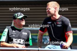 (L to R): Valtteri Bottas (FIN) Sauber with Kevin Magnussen (DEN) Haas F1 Team on the drivers' parade. 28.07.2024. Formula 1 World Championship, Rd 14, Belgian Grand Prix, Spa Francorchamps, Belgium, Race Day.