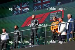 The podium (L to R): Joey McMillan (GBR) Mercedes AMG F1 Lead Race Strategist; Lewis Hamilton (GBR) Mercedes AMG F1, second; George Russell (GBR) Mercedes AMG F1, race winner; Oscar Piastri (AUS) McLaren, third. 28.07.2024. Formula 1 World Championship, Rd 14, Belgian Grand Prix, Spa Francorchamps, Belgium, Race Day.