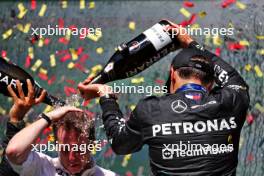 Race winner George Russell (GBR) Mercedes AMG F1 celebrates on the podium with Joey McMillan (GBR) Mercedes AMG F1 Lead Race Strategist. 28.07.2024. Formula 1 World Championship, Rd 14, Belgian Grand Prix, Spa Francorchamps, Belgium, Race Day.