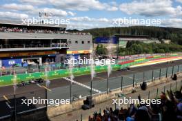 Race winner George Russell (GBR) Mercedes AMG F1 W15 takes the chequered flag at the end of the race ahead of second placed Lewis Hamilton (GBR) Mercedes AMG F1 W15 and third placed Oscar Piastri (AUS) McLaren MCL38. 28.07.2024. Formula 1 World Championship, Rd 14, Belgian Grand Prix, Spa Francorchamps, Belgium, Race Day.