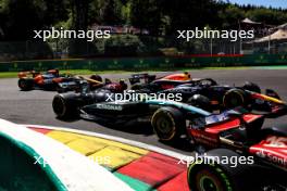 Lewis Hamilton (GBR) Mercedes AMG F1 W15 and Sergio Perez (MEX) Red Bull Racing RB20 at the start of the race. 28.07.2024. Formula 1 World Championship, Rd 14, Belgian Grand Prix, Spa Francorchamps, Belgium, Race Day.