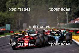 Charles Leclerc (MON) Ferrari SF-24 leads at the start of the race. 28.07.2024. Formula 1 World Championship, Rd 14, Belgian Grand Prix, Spa Francorchamps, Belgium, Race Day.