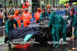 The damaged Aston Martin F1 Team AMR24 of Lance Stroll (CDN) is recovered back to the pits after he crashed in the third practice session. 27.07.2024. Formula 1 World Championship, Rd 14, Belgian Grand Prix, Spa Francorchamps, Belgium, Qualifying Day.
