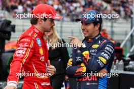 (L to R): Charles Leclerc (MON) Ferrari with Sergio Perez (MEX) Red Bull Racing in qualifying parc ferme. 27.07.2024. Formula 1 World Championship, Rd 14, Belgian Grand Prix, Spa Francorchamps, Belgium, Qualifying Day.
