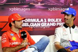(L to R): Carlos Sainz Jr (ESP) Ferrari and Daniel Ricciardo (AUS) RB in the FIA Press Conference. 25.07.2024. Formula 1 World Championship, Rd 14, Belgian Grand Prix, Spa Francorchamps, Belgium, Preparation Day.