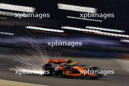 Lando Norris (GBR) McLaren MCL38 sends sparks flying. 01.03.2024. Formula 1 World Championship, Rd 1, Bahrain Grand Prix, Sakhir, Bahrain, Qualifying Day.