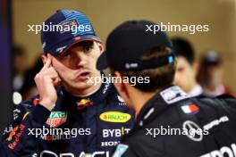 Max Verstappen (NLD) Red Bull Racing with George Russell (GBR) Mercedes AMG F1 in qualifying parc ferme. 01.03.2024. Formula 1 World Championship, Rd 1, Bahrain Grand Prix, Sakhir, Bahrain, Qualifying Day.