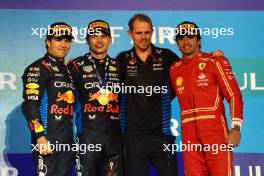 2nd place Sergio Perez (MEX) Red Bull Racing RB20 with 1st place Max Verstappen (NLD) Red Bull Racing RB20, Tom Hart (GBR) Red Bull Racing Performance Engineer and 3rd place Carlos Sainz Jr (ESP) Ferrari SF-24. 02.03.2024. Formula 1 World Championship, Rd 1, Bahrain Grand Prix, Sakhir, Bahrain, Race Day.