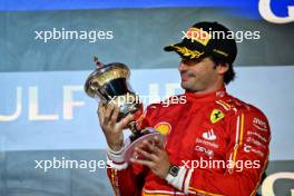 Carlos Sainz Jr (ESP) Ferrari celebrates his third position on the podium. 02.03.2024. Formula 1 World Championship, Rd 1, Bahrain Grand Prix, Sakhir, Bahrain, Race Day.