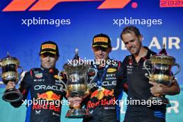 The podium (L to R): Sergio Perez (MEX) Red Bull Racing, second; Max Verstappen (NLD) Red Bull Racing, race winner; Tom Hart (GBR) Red Bull Racing Performance Engineer. 02.03.2024. Formula 1 World Championship, Rd 1, Bahrain Grand Prix, Sakhir, Bahrain, Race Day.