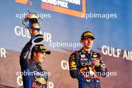 Sergio Perez (MEX) Red Bull Racing celebrates his second position on the podium. 02.03.2024. Formula 1 World Championship, Rd 1, Bahrain Grand Prix, Sakhir, Bahrain, Race Day.