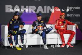 (L to R): Sergio Perez (MEX) Red Bull Racing; Max Verstappen (NLD) Red Bull Racing; and Carlos Sainz Jr (ESP) Ferrari, in the post race FIA Press Conference. 02.03.2024. Formula 1 World Championship, Rd 1, Bahrain Grand Prix, Sakhir, Bahrain, Race Day.