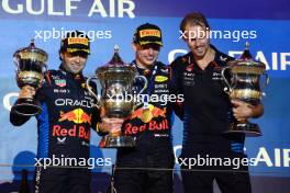 2nd place Sergio Perez (MEX) Red Bull Racing RB20 with 1st place Max Verstappen (NLD) Red Bull Racing RB20, Tom Hart (GBR) Red Bull Racing Performance Engineer . 02.03.2024. Formula 1 World Championship, Rd 1, Bahrain Grand Prix, Sakhir, Bahrain, Race Day.