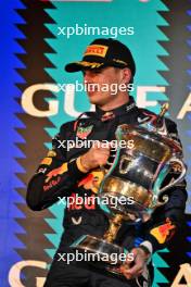 Race winner Max Verstappen (NLD) Red Bull Racing celebrates in on the podium. 02.03.2024. Formula 1 World Championship, Rd 1, Bahrain Grand Prix, Sakhir, Bahrain, Race Day.