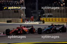 Charles Leclerc (MON) Ferrari SF-24 and George Russell (GBR) Mercedes AMG F1 W15 battle for position. 02.03.2024. Formula 1 World Championship, Rd 1, Bahrain Grand Prix, Sakhir, Bahrain, Race Day.