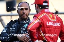 (L to R): Lewis Hamilton (GBR) Mercedes AMG F1 with Charles Leclerc (MON) Ferrari on the drivers' parade. 02.03.2024. Formula 1 World Championship, Rd 1, Bahrain Grand Prix, Sakhir, Bahrain, Race Day.