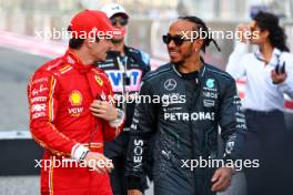 (L to R): Charles Leclerc (MON) Ferrari with Lewis Hamilton (GBR) Mercedes AMG F1. 02.03.2024. Formula 1 World Championship, Rd 1, Bahrain Grand Prix, Sakhir, Bahrain, Race Day.