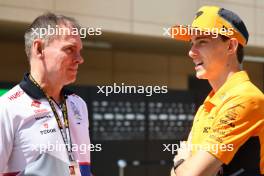 (L to R): Alan Permane (GBR) RB Sporting Director with Oscar Piastri (AUS) McLaren. 29.02.2024. Formula 1 World Championship, Rd 1, Bahrain Grand Prix, Sakhir, Bahrain, Practice Day