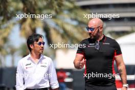 (L to R): Ayao Komatsu (JPN) Haas F1 Team Principal with Stuart Morrison (GBR) Haas F1 Team Head of Communications. 28.02.2024. Formula 1 World Championship, Rd 1, Bahrain Grand Prix, Sakhir, Bahrain, Preparation Day.